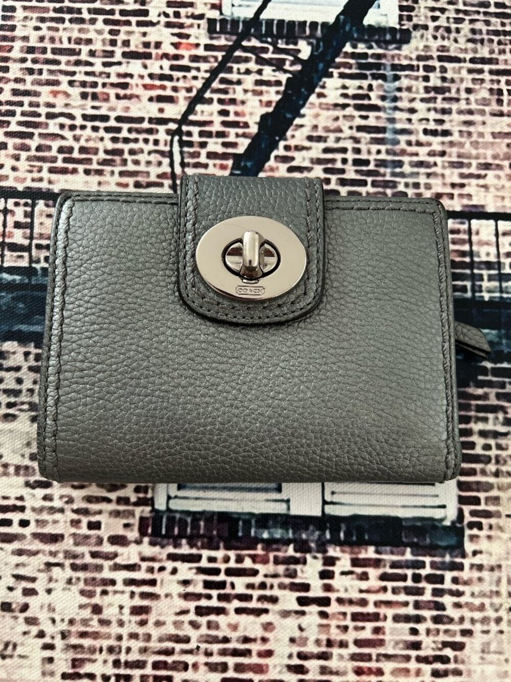 Coach bi fold pebbled turnlock wallet